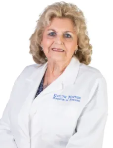 Evelyn Minton, Director of Nursing, in a white coat